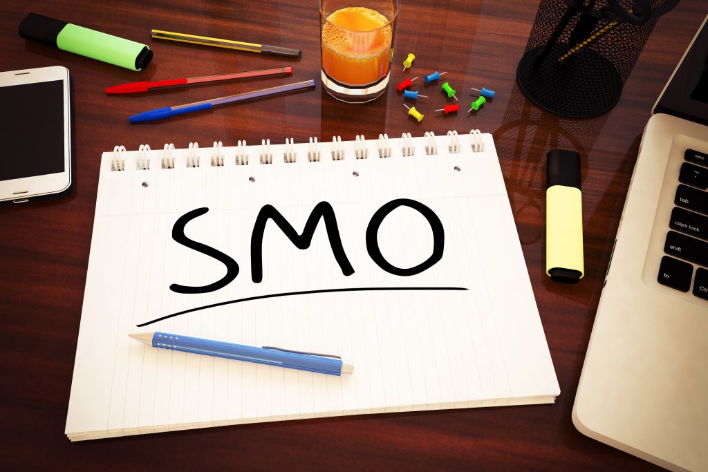 SMO - Social Media Optimization - handwritten text in a notebook on a desk - 3d render illustration.