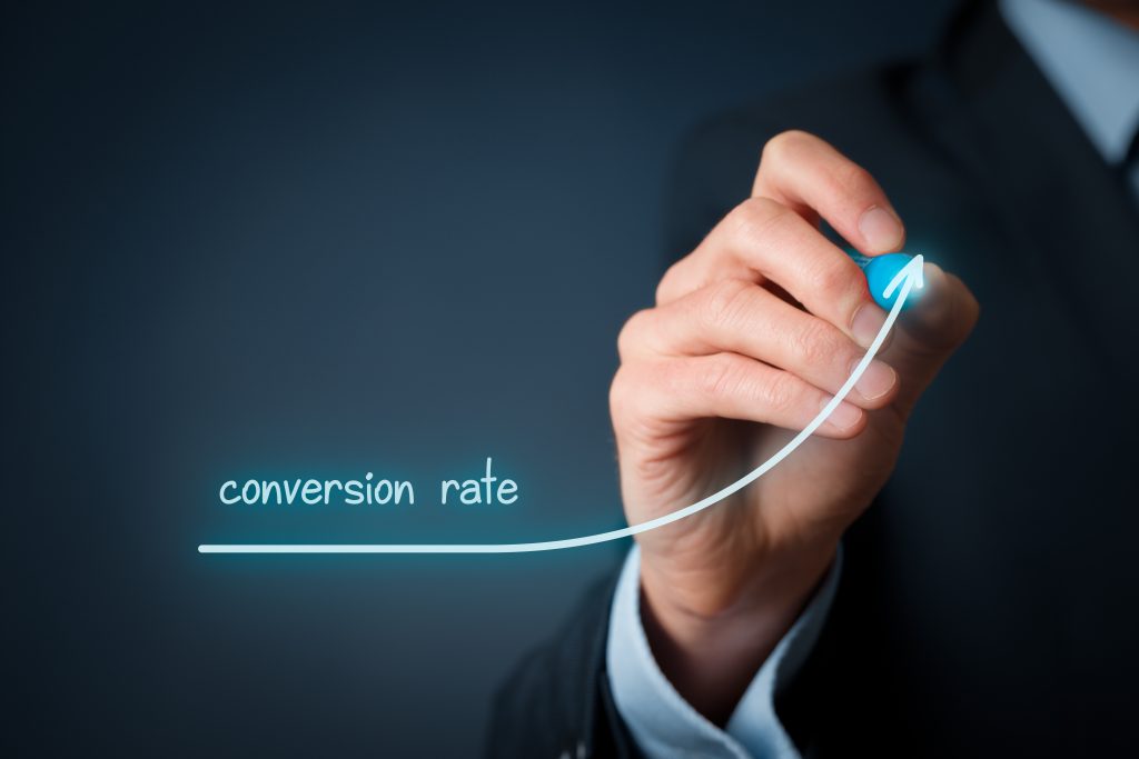 Conversion rate (internet marketing) concept. Businessman (marketer) draw growing graph of rise conversion rate.