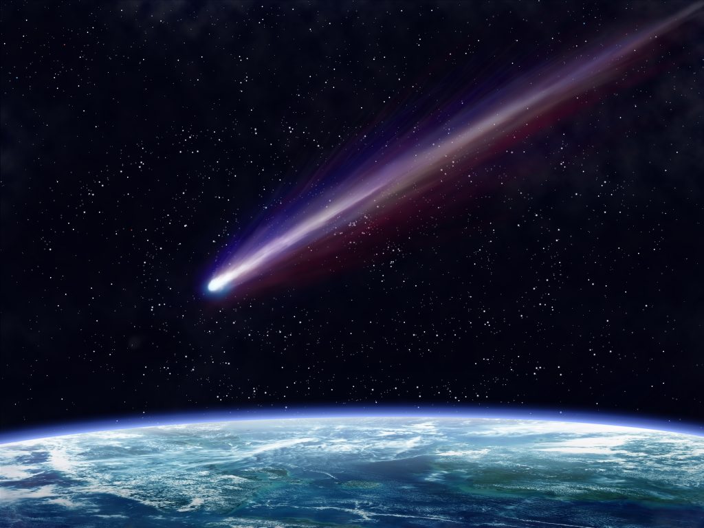 15432124 - illustration of a comet flying through space close to the earth