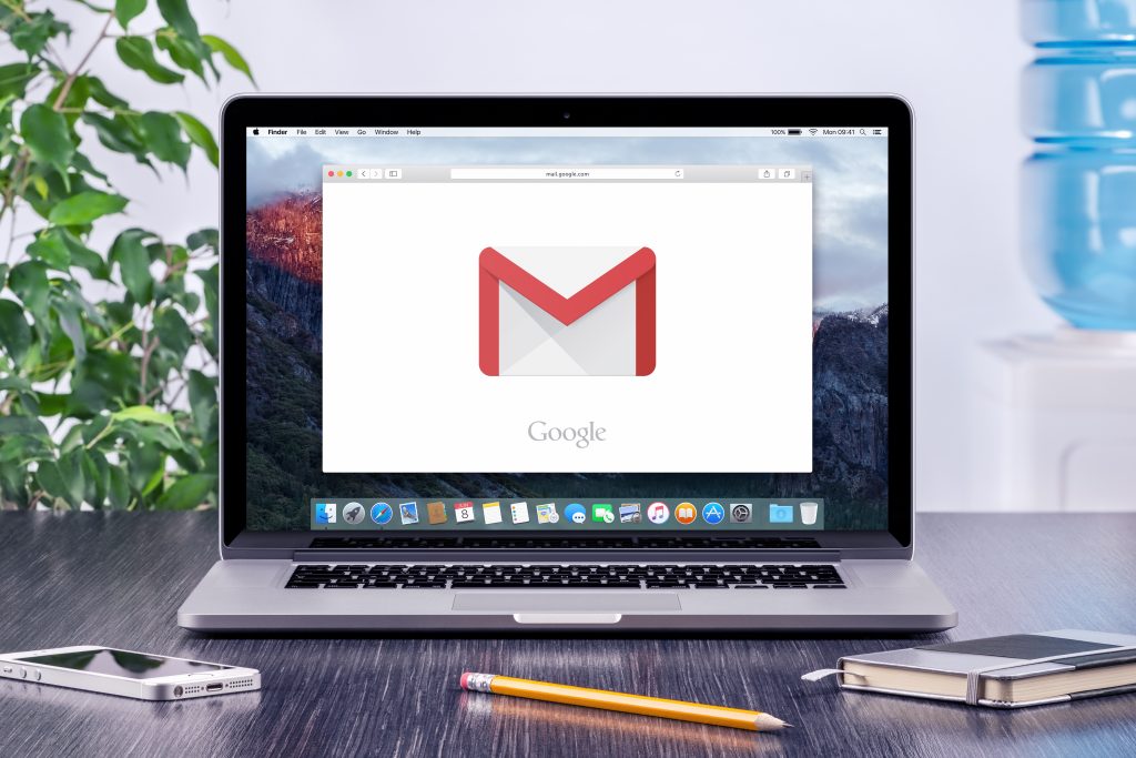 Varna, Bulgaria - May 31, 2015: Google Gmail logo on the Apple MacBook Pro display that is on office desk workplace. Gmail is a free e-mail service provided by Google.