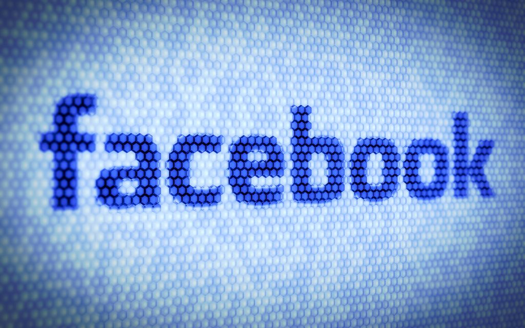14740382 - 3d illustration of facebook text on computer screen
