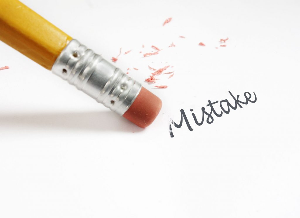 30702030 - closeup of a pencil eraser fixing an  mistake