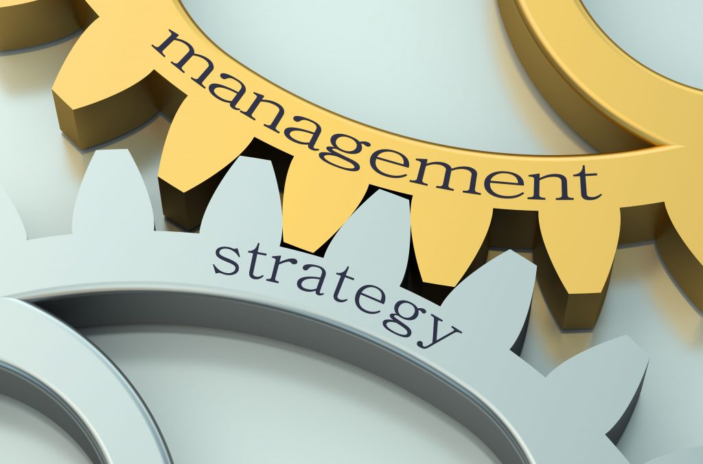 Management and Strategy concept on metallic gearwheel