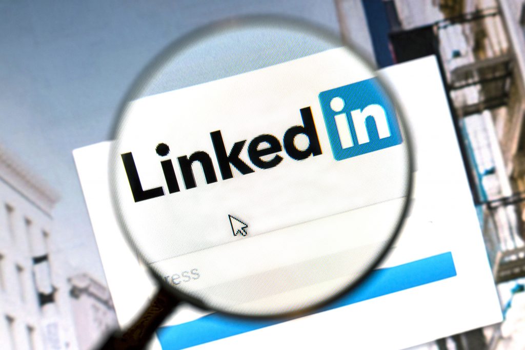 43486899 - linkedin website under a magnifying glass. linkedin is a business oriented social networking website.