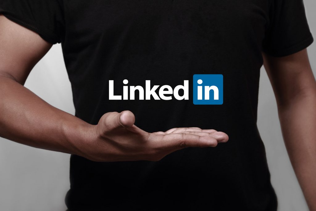 36841079 - johor, malaysia - may 11, 2014: hand showing linkedin icon. linkedin is a famous social networking website, may 11, 2014 in johor, malaysia.