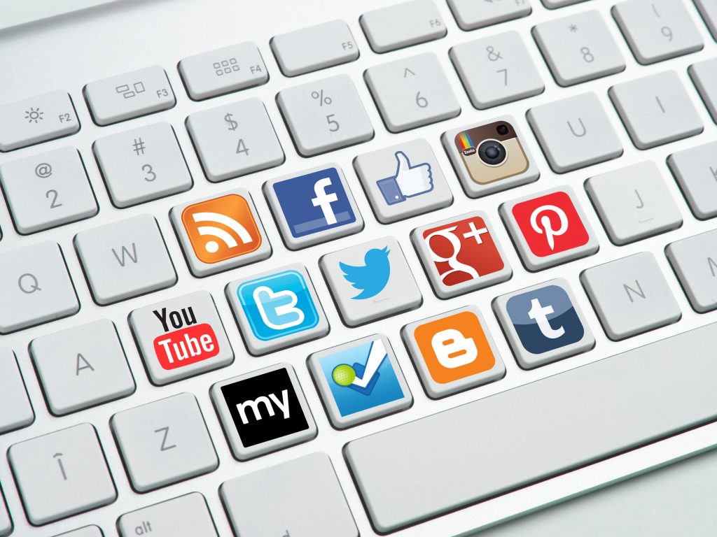 social media channels platforms applications icons logos buttons on keyboard