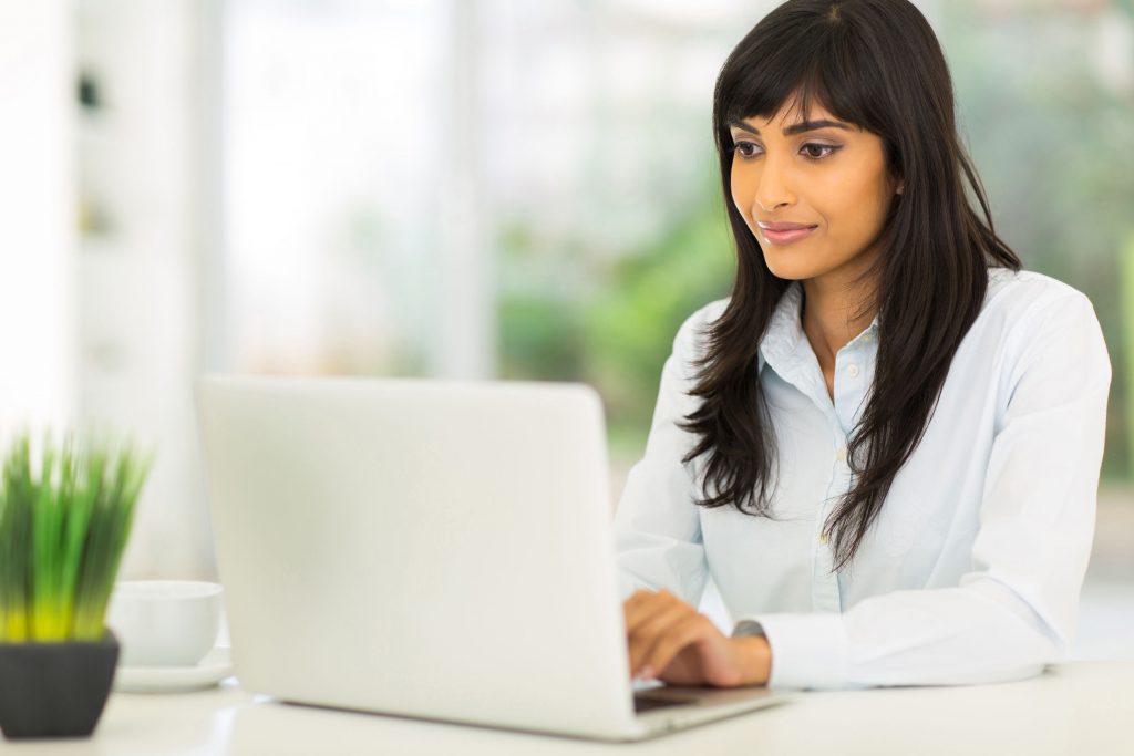 29899864 - pretty indian businesswoman using computer in office