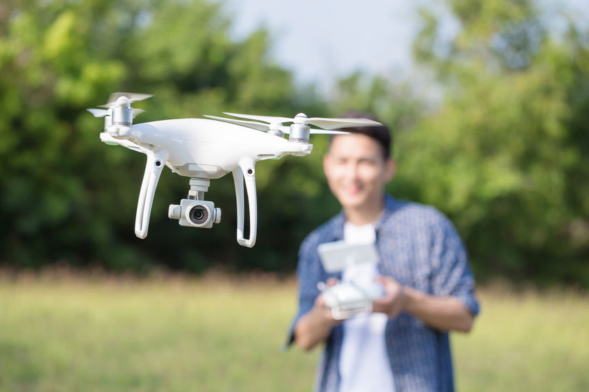 asia man play drone in the outdoor